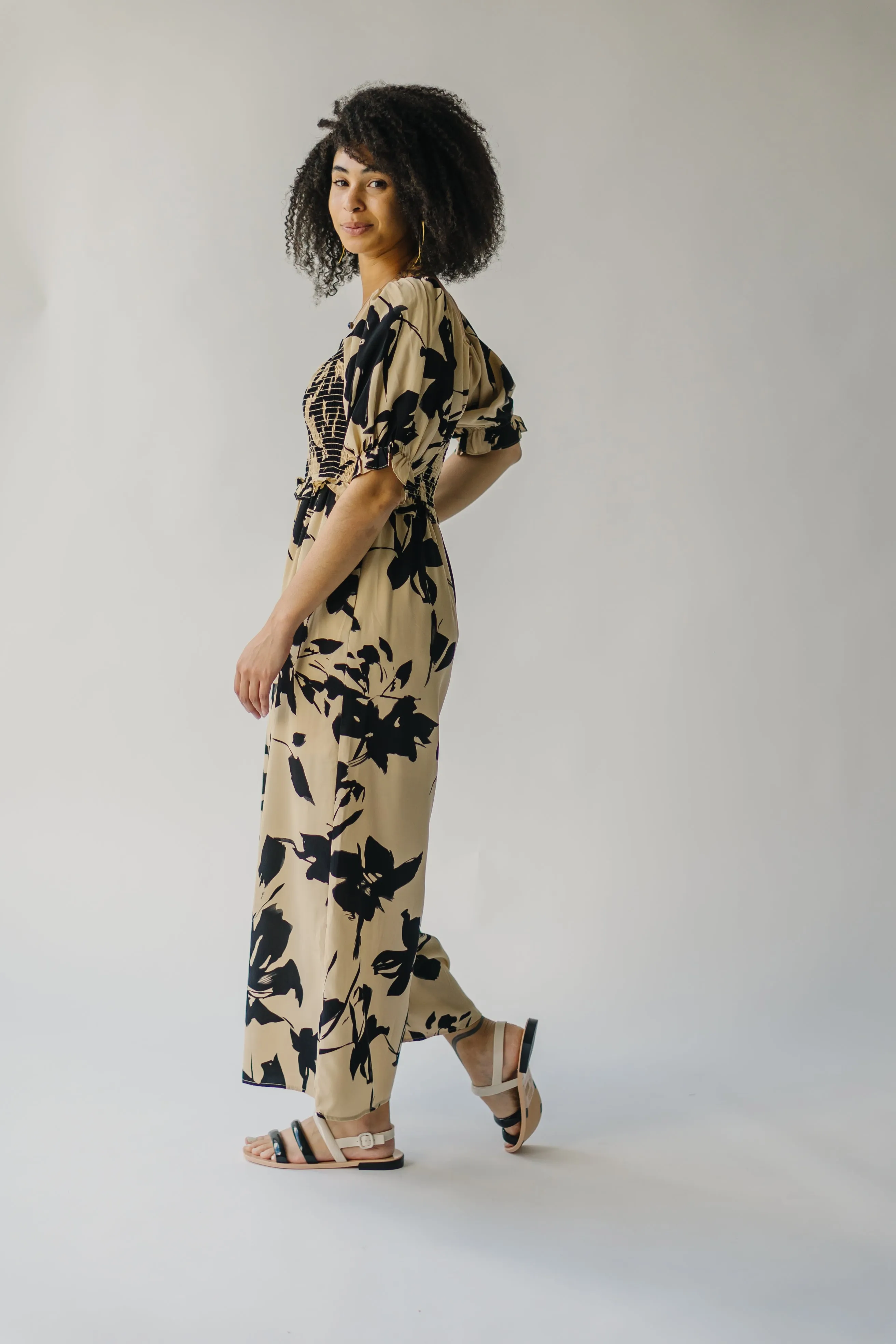 The Maggard Smocked Floral Jumpsuit in Taupe